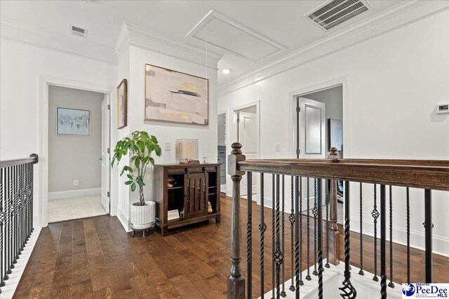 207 Compass Trl, Blythewood, SC 29016 - hallway with ornamental molding, an upstairs landing, attic access, visible vents, and wood finished floors