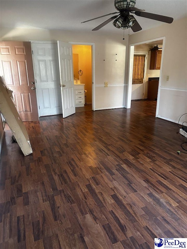 interior space featuring dark wood-type flooring and a ceiling fan