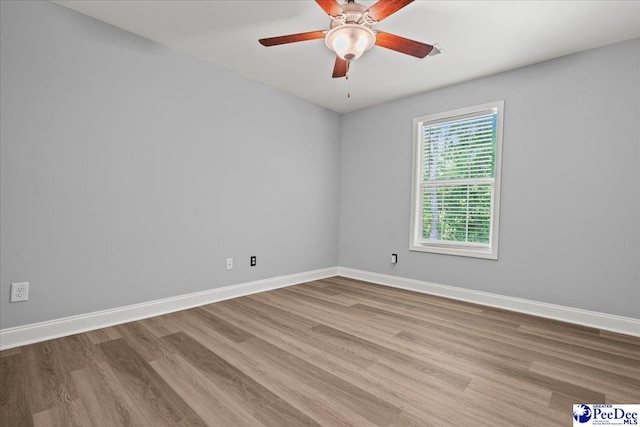 3324 Spiral Ln, Effingham, SC 29541 - empty room featuring wood finished floors, baseboards, and ceiling fan
