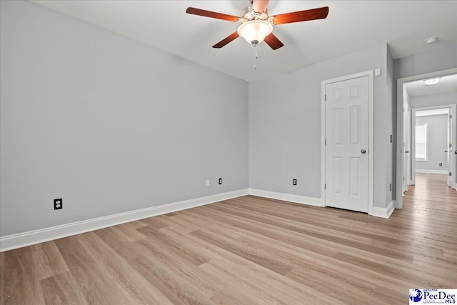 3324 Spiral Ln, Effingham, SC 29541 - unfurnished bedroom with baseboards, light wood finished floors, and a ceiling fan