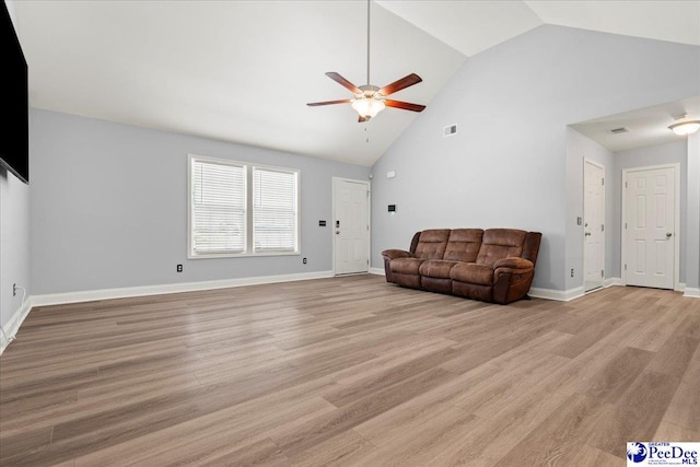 3324 Spiral Ln, Effingham, SC 29541 - unfurnished living room with light wood-style flooring, baseboards, visible vents, ceiling fan, and high vaulted ceiling