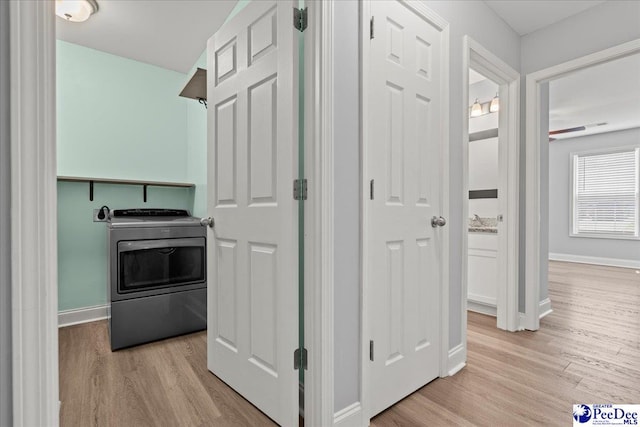 3324 Spiral Ln, Effingham, SC 29541 - hallway with light wood finished floors and baseboards
