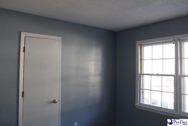 3028 Trent Dr, Florence, SC 29505 - spare room featuring a textured ceiling