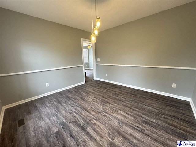 empty room featuring dark hardwood / wood-style floors