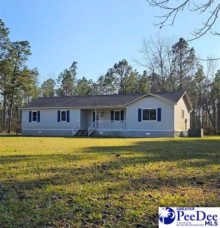 ranch-style house with a front lawn