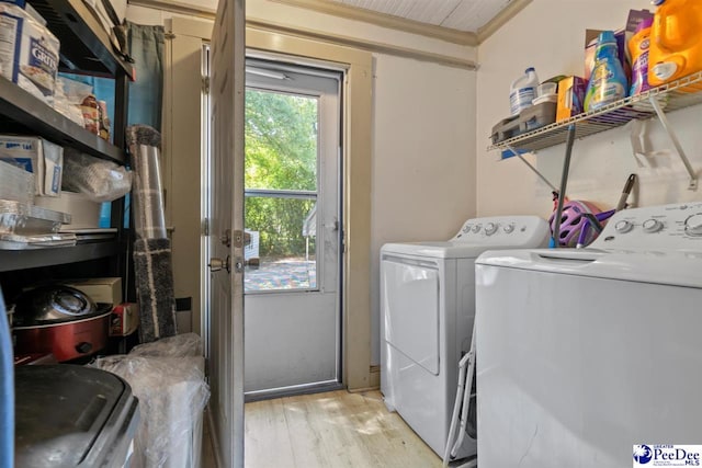 427 Marlboro Ave, Hartsville, SC 29550 - laundry area with crown molding, separate washer and dryer, and light hardwood / wood-style flooring