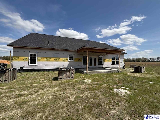 back of house featuring french doors