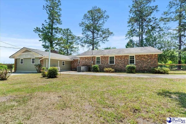 821 W Shirley Rd, Pamplico, SC 29583 - ranch-style home with a front lawn, brick siding, and concrete driveway