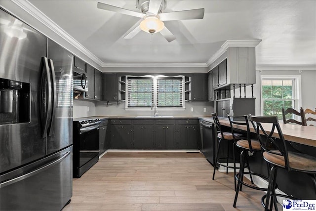 821 W Shirley Rd, Pamplico, SC 29583 - kitchen featuring appliances with stainless steel finishes, open shelves, a sink, crown molding, and ceiling fan