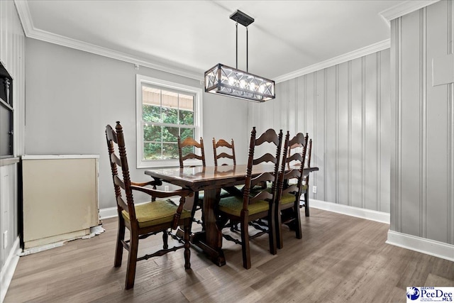821 W Shirley Rd, Pamplico, SC 29583 - dining space featuring ornamental molding, a chandelier, light wood finished floors, and baseboards