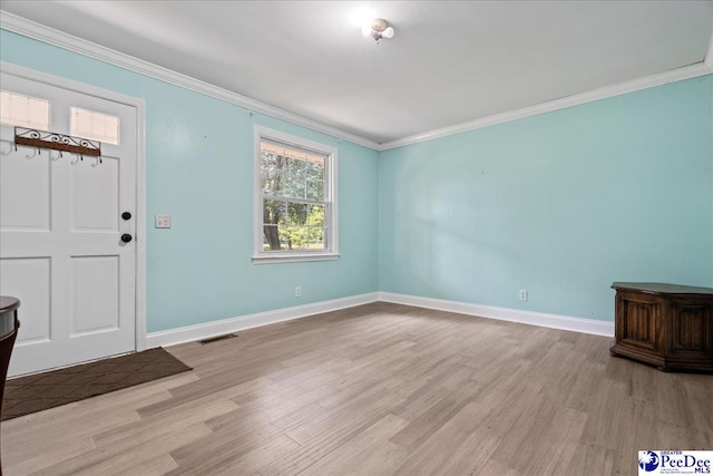 821 W Shirley Rd, Pamplico, SC 29583 - foyer featuring ornamental molding, light wood-style floors, and baseboards