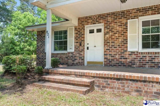 821 W Shirley Rd, Pamplico, SC 29583 - doorway to property featuring brick siding