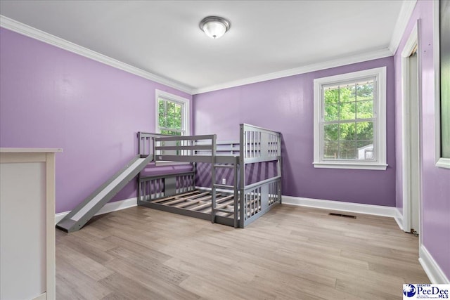 821 W Shirley Rd, Pamplico, SC 29583 - bedroom featuring ornamental molding, wood finished floors, and baseboards