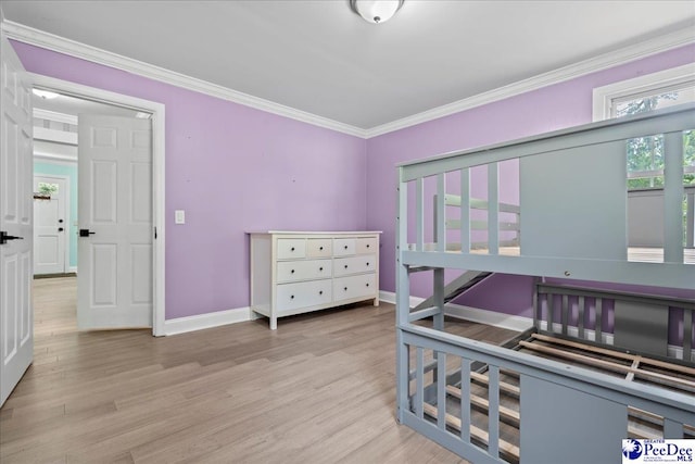 821 W Shirley Rd, Pamplico, SC 29583 - bedroom featuring light wood finished floors, baseboards, and crown molding