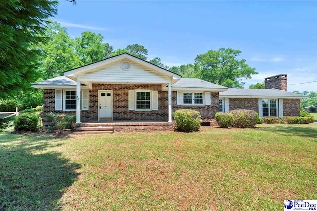 821 W Shirley Rd, Pamplico, SC 29583 - single story home featuring brick siding, a front lawn, a chimney, and a porch
