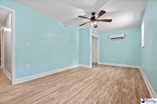 821 W Shirley Rd, Pamplico, SC 29583 - unfurnished room with a wall mounted air conditioner, ceiling fan, light wood-style floors, and baseboards