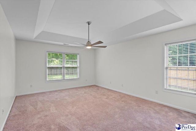 2264 Inverness Dr, Florence, SC 29505 - unfurnished room featuring carpet floors, a raised ceiling, ceiling fan, and baseboards