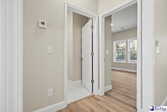 corridor featuring light hardwood / wood-style floors