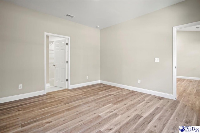 unfurnished room featuring light wood-type flooring