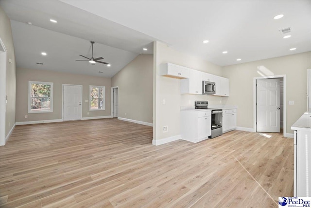 unfurnished living room featuring lofted ceiling, light hardwood / wood-style floors, and ceiling fan