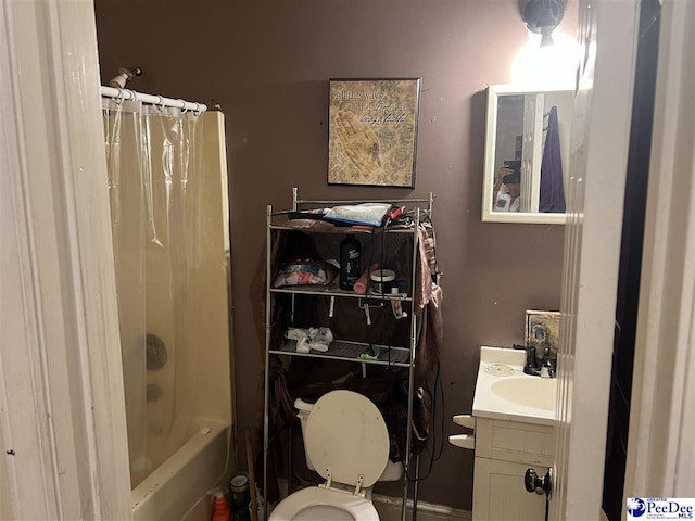 full bathroom featuring vanity, shower / bath combination with curtain, and toilet