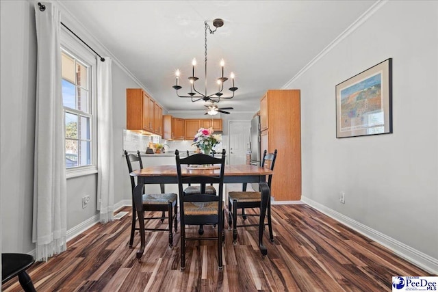 dining area with dark wood finished floors, baseboards, and ornamental molding