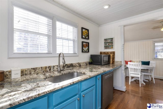 kitchen featuring blue cabinetry, ornamental molding, stainless steel appliances, and a sink