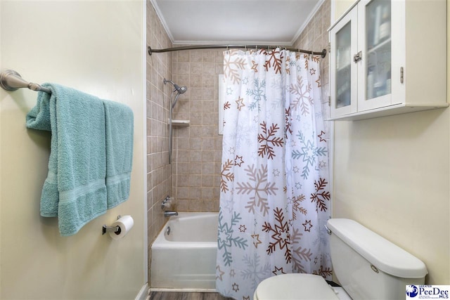 bathroom with ornamental molding, shower / bath combination with curtain, and toilet