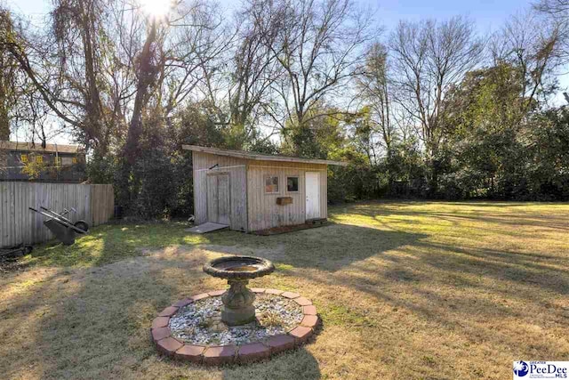 view of yard featuring a storage shed and an outdoor structure