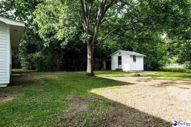 306 Mimosa Dr, Cheraw, SC 29520 - view of grassy yard with an outbuilding