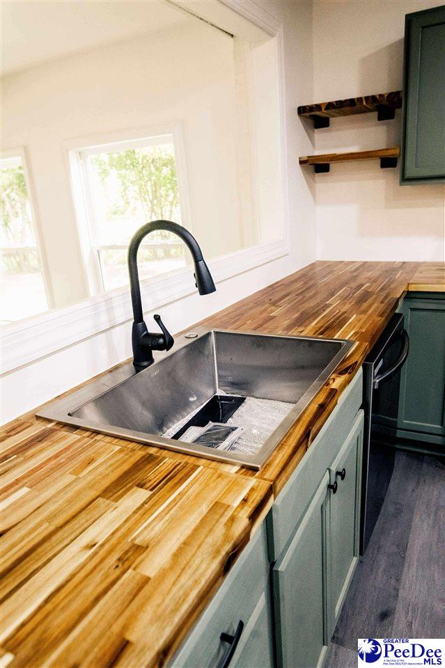306 Mimosa Dr, Cheraw, SC 29520 - kitchen featuring wood counters, green cabinets, open shelves, and dishwasher
