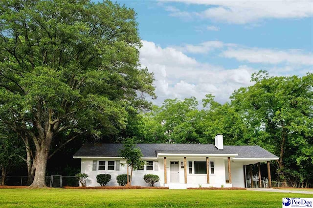 306 Mimosa Dr, Cheraw, SC 29520 - ranch-style house with a chimney, a carport, and covered porch