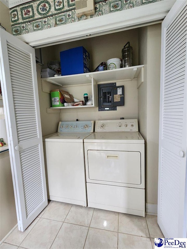 129 Golf Course Rd, Hartsville, SC 29550 - laundry area with light tile patterned flooring, washer and dryer, and baseboards