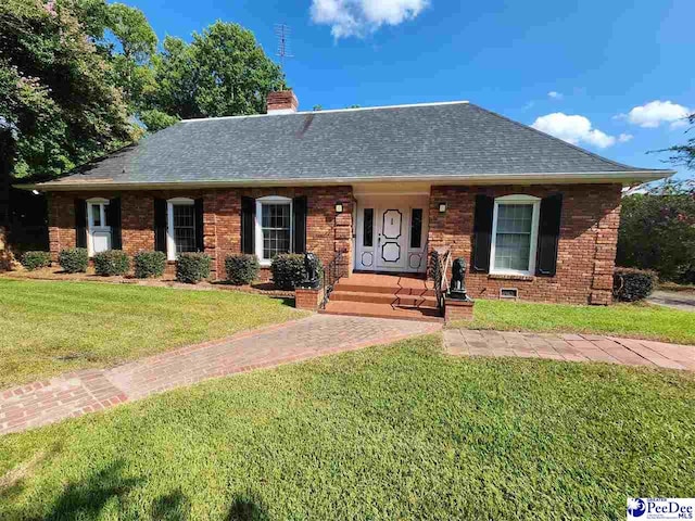 129 Golf Course Rd, Hartsville, SC 29550 - view of front of property with a shingled roof, a chimney, a front lawn, and brick siding