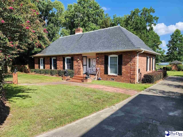 129 Golf Course Rd, Hartsville, SC 29550 - view of front of property featuring brick siding, a chimney, a shingled roof, and a front yard