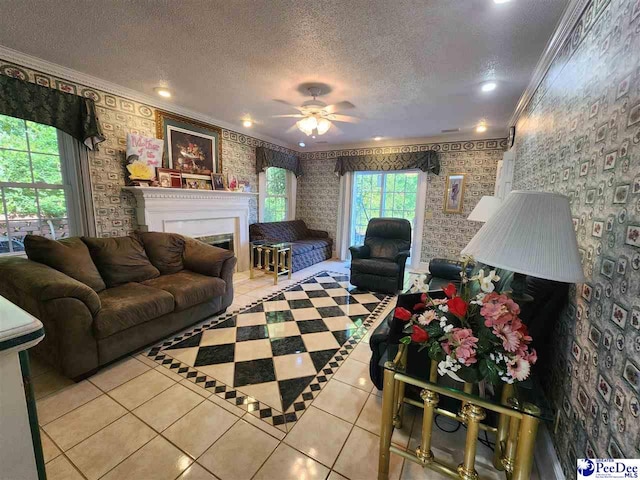 129 Golf Course Rd, Hartsville, SC 29550 - living room with ornamental molding, tile patterned flooring, plenty of natural light, a textured ceiling, and a ceiling fan