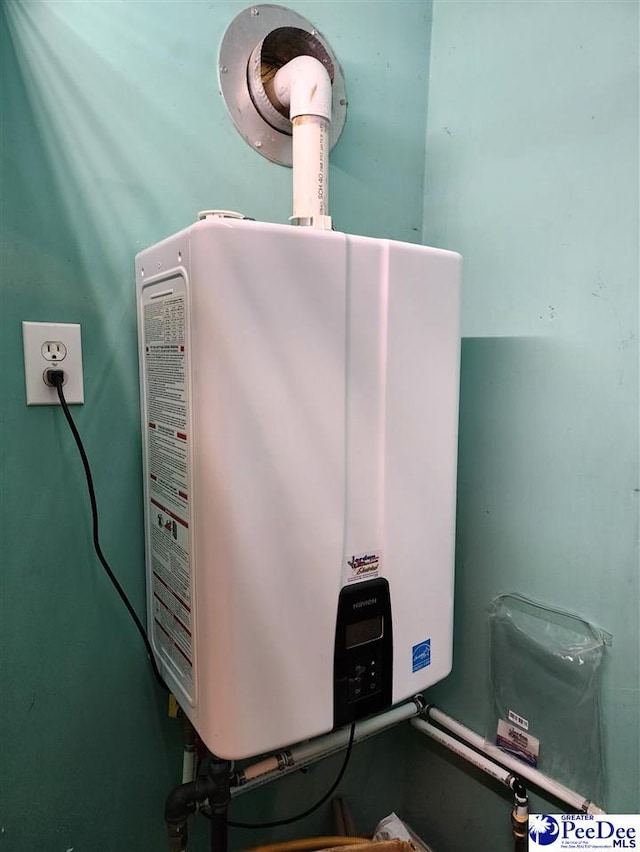 129 Golf Course Rd, Hartsville, SC 29550 - utility room with tankless water heater