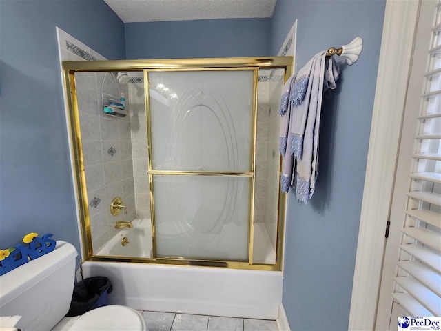 129 Golf Course Rd, Hartsville, SC 29550 - bathroom with toilet, enclosed tub / shower combo, tile patterned flooring, and a textured ceiling