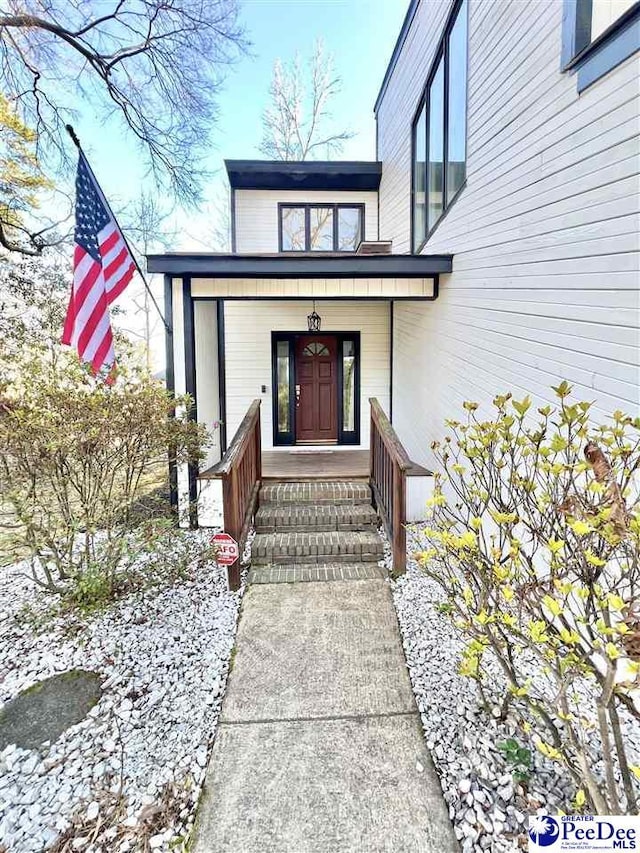 property entrance featuring covered porch