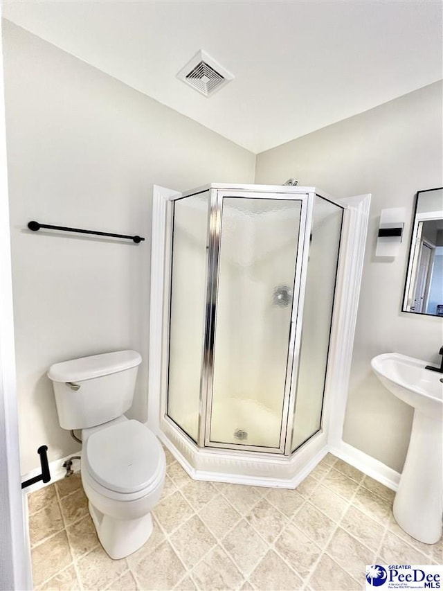 full bath with tile patterned floors, visible vents, toilet, and a shower stall