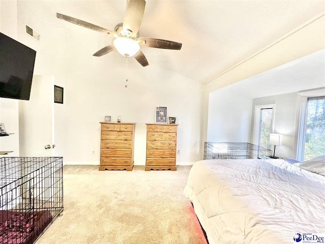 bedroom featuring visible vents, ceiling fan, baseboards, lofted ceiling, and light carpet