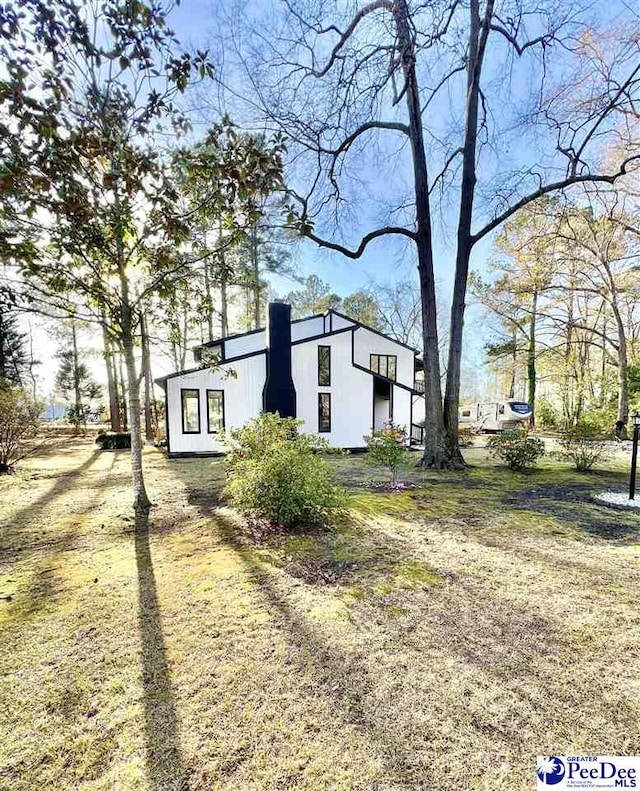 exterior space featuring a chimney