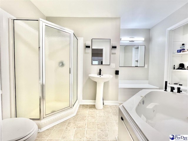 full bathroom with baseboards, toilet, a tub with jets, and a shower stall