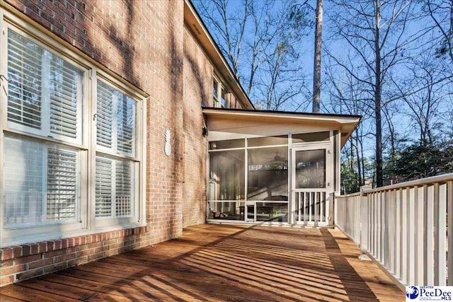 deck with a sunroom