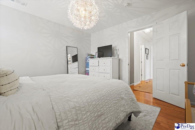 bedroom with wood-type flooring