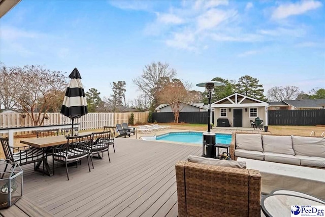 view of pool featuring an outdoor structure and a deck