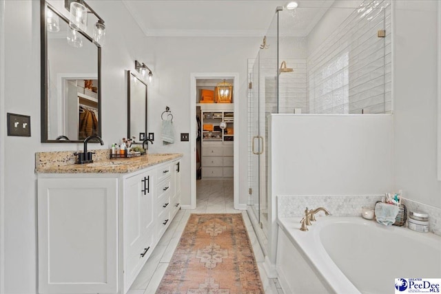 bathroom with tile patterned flooring, vanity, separate shower and tub, and ornamental molding