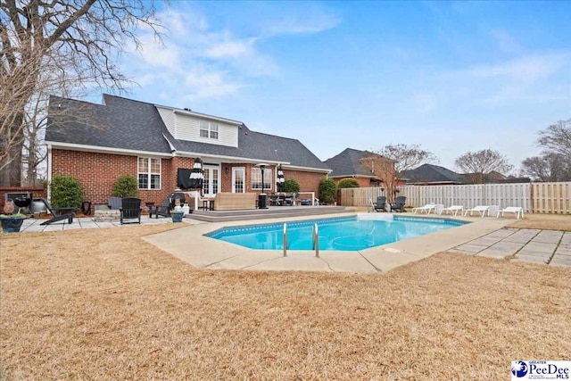 view of pool featuring a deck and a patio