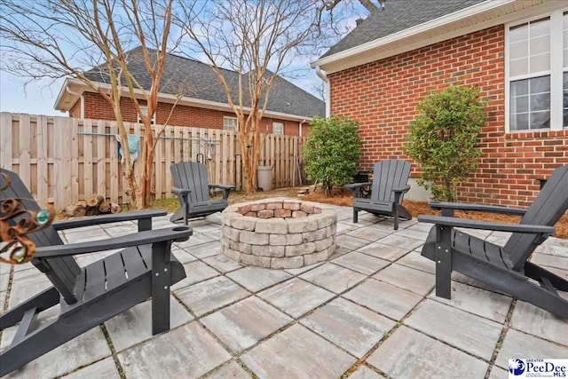 view of patio with a fire pit