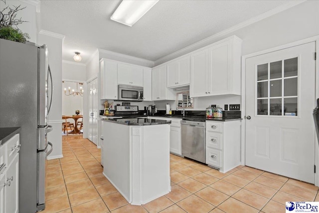 kitchen featuring light tile patterned flooring, appliances with stainless steel finishes, sink, white cabinets, and ornamental molding